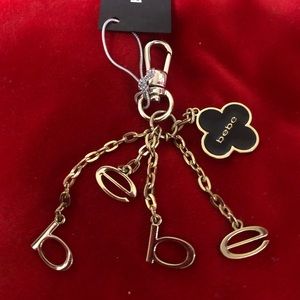 Brand new Bebe Gold hardware key/ handbag charm